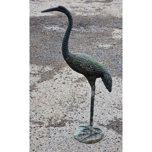 1067 - Metal bronzed garden ornament of a crane, H 87cm