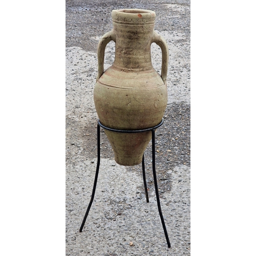 1078 - Terracotta amphora urn with twin loop handles on stand, H 65cm