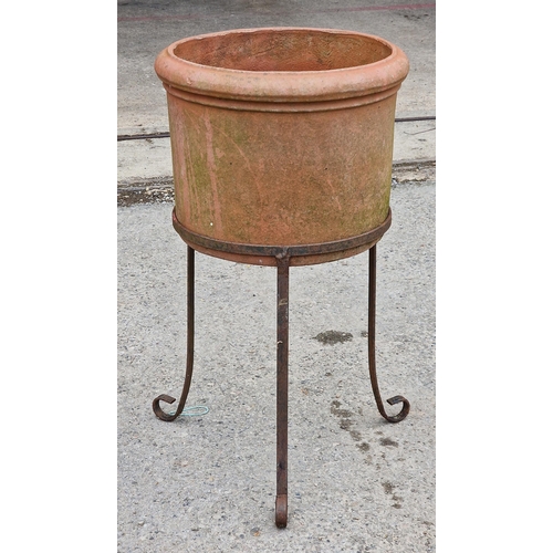 1079 - Circular terracotta planter on wrought iron stand, H 67cm x W 37cm