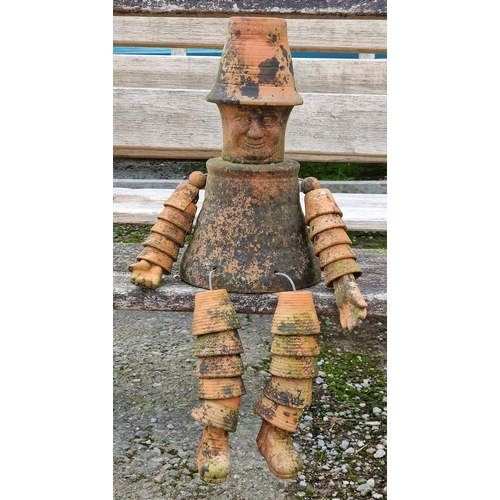 1083 - Weathered terracotta garden ornament of a plant pot man, H 60cm