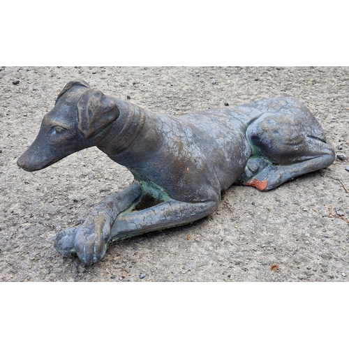 1088 - Terracotta bronzed effect ornament of a recumbent greyhound, H 123cm x W 60cm (AF)