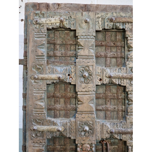 1127 - Good quality pair of antique Moroccan hardwood doors with iron strapwork and carved detail, H 183cm ... 