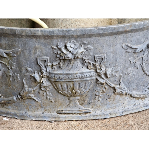 1128 - Exceptional quality antique bow front lead water feature with lions mask and urn detail, complete wi... 