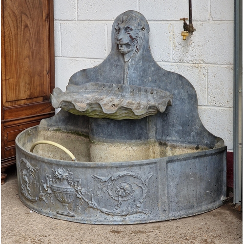 1128 - Exceptional quality antique bow front lead water feature with lions mask and urn detail, complete wi... 