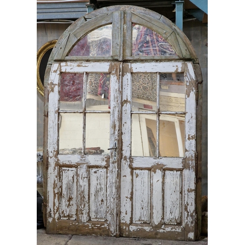 1140 - Large reclaimed French arched church doors with distressed paintwork, H 275cm x W 188cm