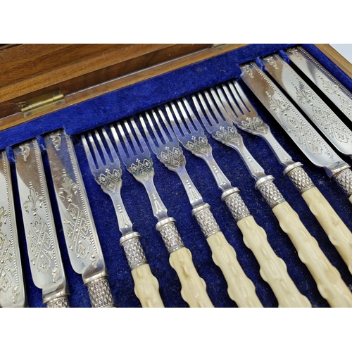 224 - Canteen of twelve silver plate and bone handled fish knives and forks, with naturalistic handles, by... 