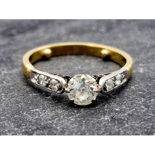 125 - Antique high carat unmarked gold and diamond ring, central 0.40ct old cut diamond flanked by four fu... 