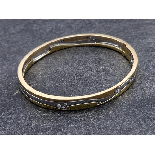 143 - Georg Jensen 'Fusion' bangle - 18ct tri-colour three piece bangle, fitted with sixteen diamonds, the... 