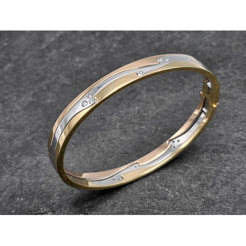 143 - Georg Jensen 'Fusion' bangle - 18ct tri-colour three piece bangle, fitted with sixteen diamonds, the... 