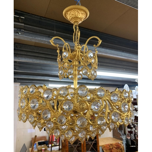 1410 - Gilt metal and crystal glass ceiling chandelier, having an ornate multi tiered scrolled frame, D 40c... 