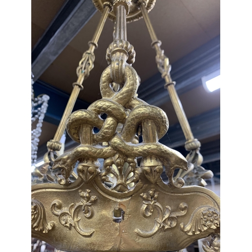 1413 - Victorian gold gilt four branch ceiling chandelier, decorated with ornate serpentine's throughout wi... 