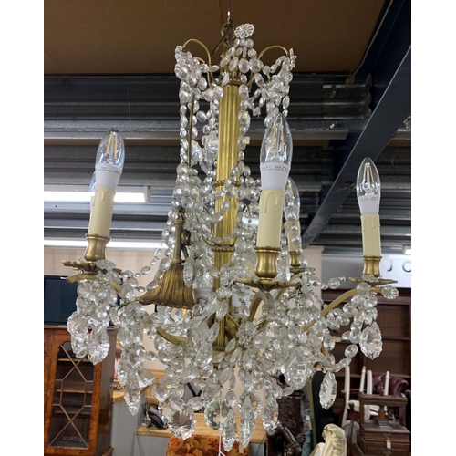 1414 - Ornate crystal drop six branch ceiling chandelier, having central Corinthian column and scrolled bra... 