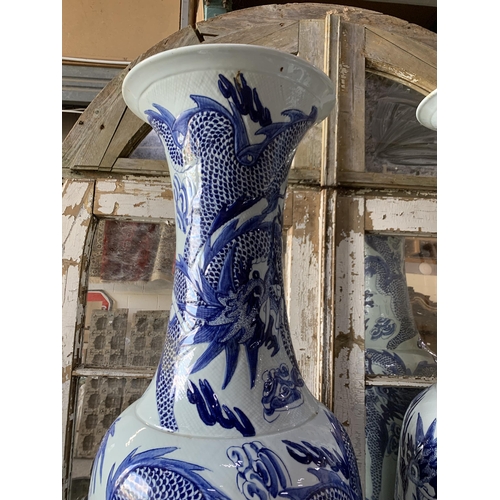 414 - Pair of enormous Chinese export blue and white porcelain floral vases, typical palette with scrolled... 