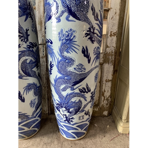 414 - Pair of enormous Chinese export blue and white porcelain floral vases, typical palette with scrolled... 