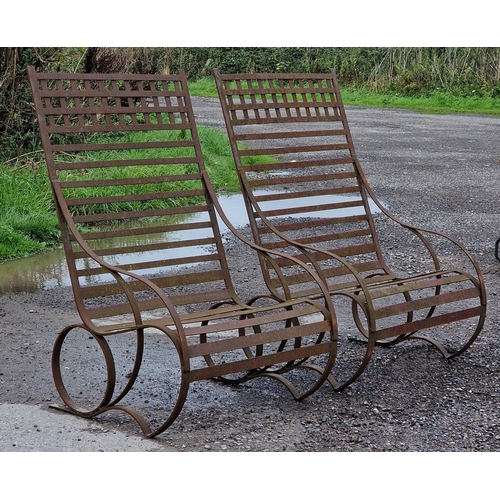 1143 - Pair of antique iron strapwork chairs of scrolled form, H 121cm (2)