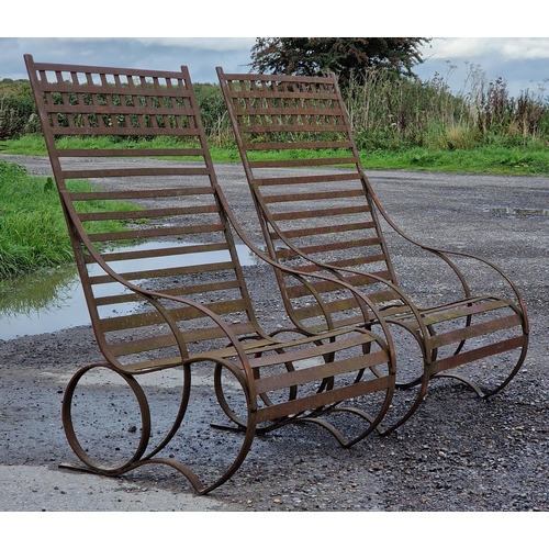 1143 - Pair of antique iron strapwork chairs of scrolled form, H 121cm (2)