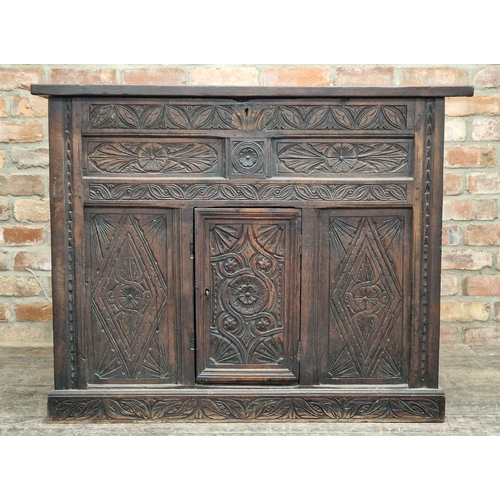 1381 - 18th century carved oak cabinet with hinged lid and single cupboard door, H 91cm x W 115cm x D 50cm