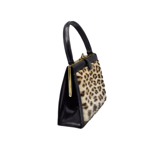 292 - Hand made ocelot fur and brass clasp handbag, 29cm x 20cm