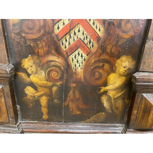 1230 - Pair of 16th/17th century arched oak panels, with original paint of a shield with cherubs and leopar... 