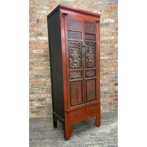 1234 - Chinese red laquered cabinet, twin doors pierced and carved with figures, enclosing shelves, two dra... 