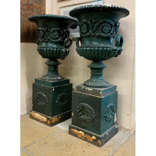 1136 - Impressive matched pair of Victorian cast iron Campana urns on pedestals with twin mask loop handles... 