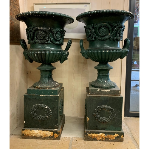 1136 - Impressive matched pair of Victorian cast iron Campana urns on pedestals with twin mask loop handles... 