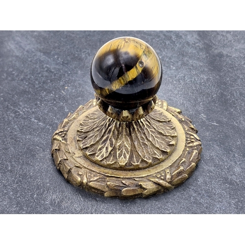 245 - Victorian brass and tigers eye desktop paperweight, signed H.H Craig, H 8cm