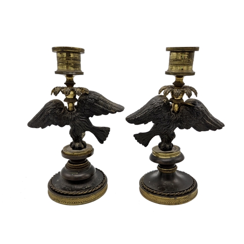 526 - Pair of antique French bronze figural candlesticks, modelled as eagles with coiled snakes, 18cm high... 