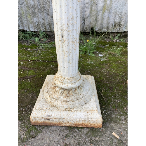 1159 - Pair of white painted cast iron pedestal urns, on fluted columns, H 82 x Dia 50cm