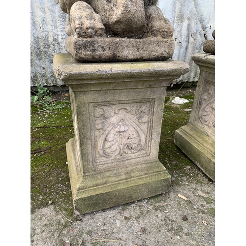 1160 - Pair good quality reconstituted stone Dragons of Griffins holding shields upon well moulded plinth b... 