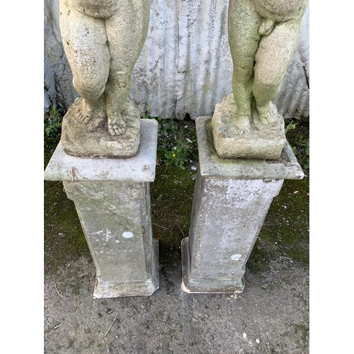 1161 - Pair of reconstituted stone cherubs on good plinth column bases, 150cm high in total (2)