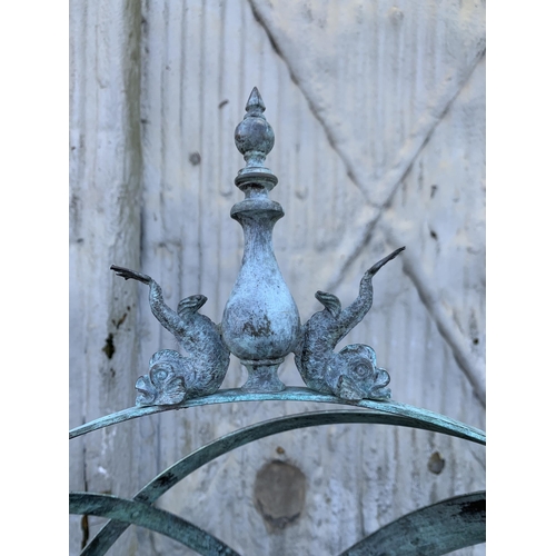 1164 - Good patinated bronze armillary sphere cast with dolphins and finial, upon a cast iron fluted column... 