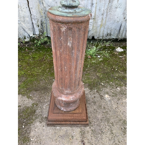 1164 - Good patinated bronze armillary sphere cast with dolphins and finial, upon a cast iron fluted column... 