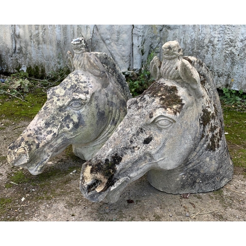 1165 - Good pair of carved natural stone horse or unicorn heads, H 50cm x W 75cm