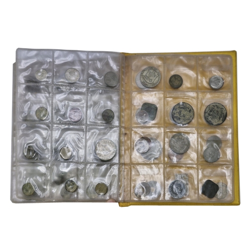 251 - Two albums of British and International coins, approx 130 coins