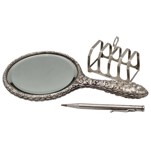 163 - Mixed silver - toast rack, engine turned propelling pencil and repousse dressing mirror (3)