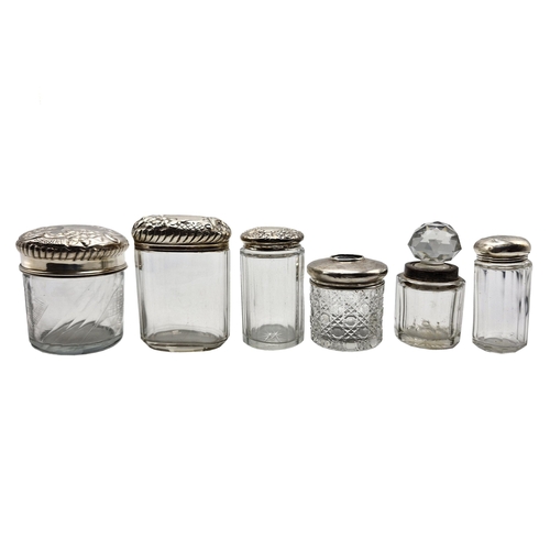 179 - Collection of five silver lidded glass scent jars, one with enamel push button, with a further ink w... 