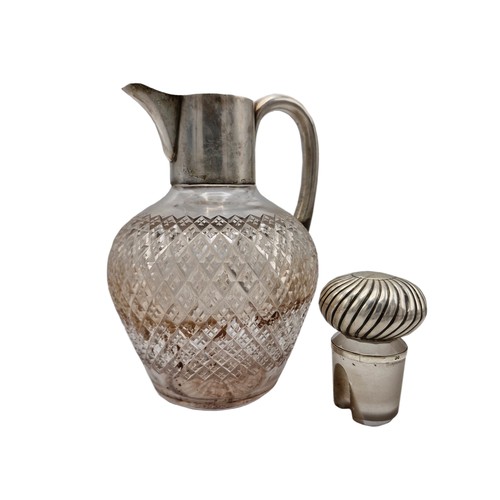 234 - Georgian silver and cut glass claret jug, the flute stopper with turn lock and pourer, 23cm high