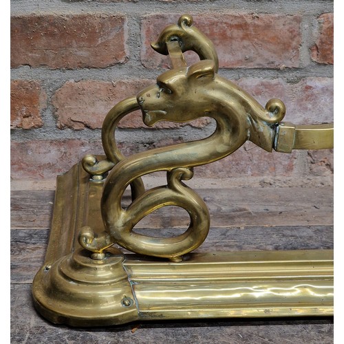 1387 - Art Nouveau scrolled brass fire fender with lions mask detail, H 29cm x W 138cm x D 38cm