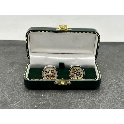 268 - Holland & Holland chrome and horn shotgun cartridge cufflinks, boxed