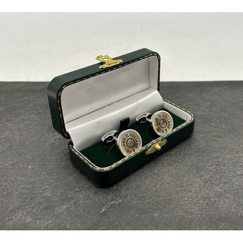 268 - Holland & Holland chrome and horn shotgun cartridge cufflinks, boxed