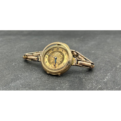 4 - Antique 12ct converted fob watch, 30mm case, engraved gilt dial, on 9ct concertina bracelet, 27.3g g... 