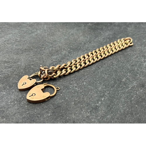 61 - 9ct rose gold curblink chain (af) with two heart padlock clasps, 12.7g