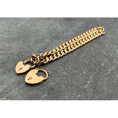 61 - 9ct rose gold curblink chain (af) with two heart padlock clasps, 12.7g