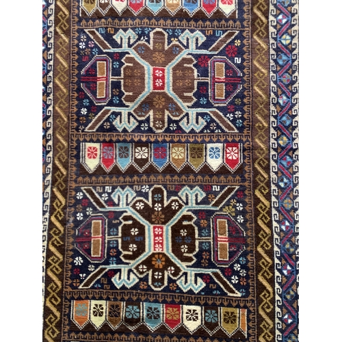 1627 - Good antique Baluchi type Persian Village rug, brown ground, 210 x 115cm