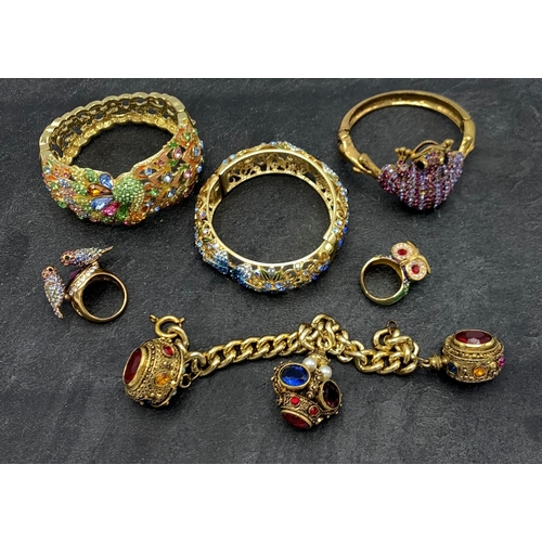 149 - Collection of Butler and Wilson type costume jewellery, comprising three bangles, two rings and curb... 