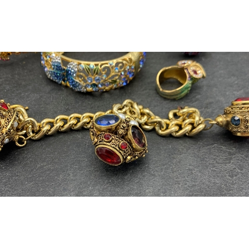 149 - Collection of Butler and Wilson type costume jewellery, comprising three bangles, two rings and curb... 