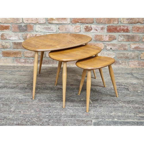 1164 - An Ercol light elm nest of three pebble tables, H 40cm x W 65cm (largest)