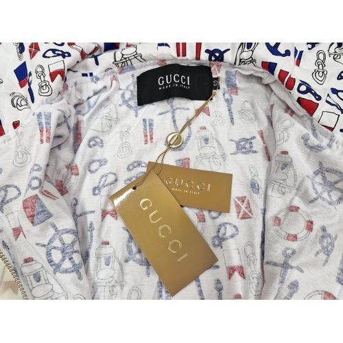 87 - Gucci plastic rain coat with nautical anchor, life ring and ships wheel pattern, size 52, BNWT