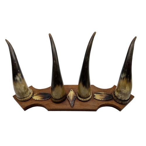 1082 - Black Forest four piece horn coat rack, W 50cm